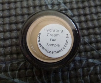 Adorn Hydrating Cream in Fair label
